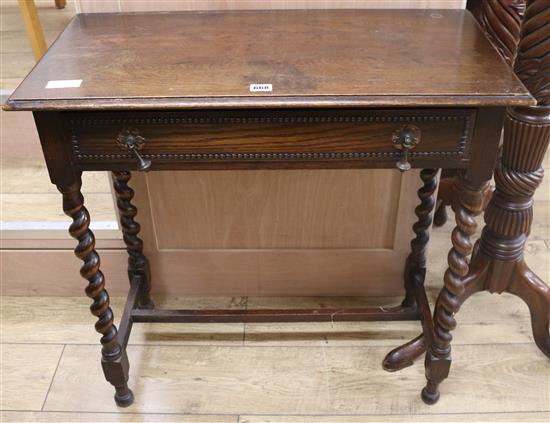 A carved oak side table, W.76cm